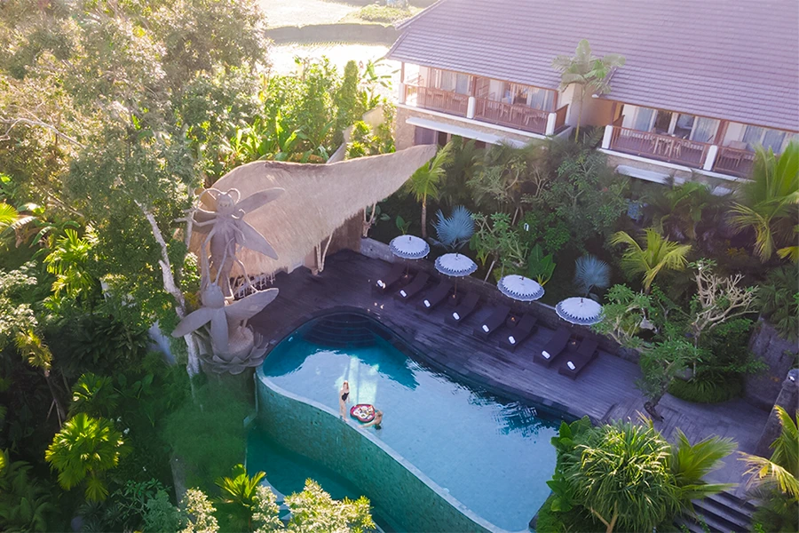Infinity pool and tropical gardens at The Sun of Granary Ubud by Inara, Bali.